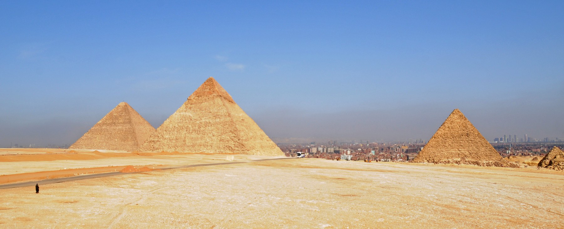 Pyramids of Giza with the Cairo skyline